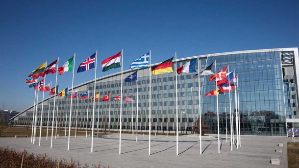 Дощовий старт тижня: на Київщині знову прогнозують опади та вітер Flags of NATO's new headquarters in Brussels, Belgium.