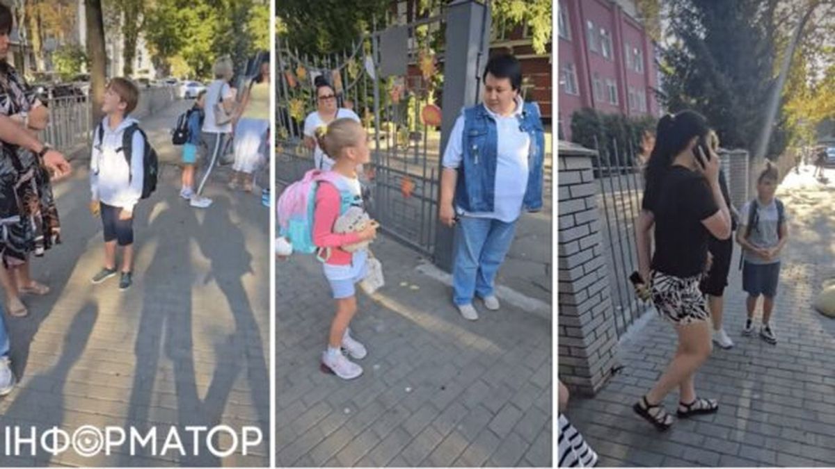 «Справа про шорти» в школі на Печерську: розслідування триває два місяці Біля входу в школу стоять діти і дорослі, зокрема директорка, яка не пускає дітей в шортах