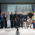Головні новини Києва | Kyiv.News Група учасників зустрічі про інклюзію на тлі екрана зі слайдом, ветеран із протезом ноги, поруч прапор України