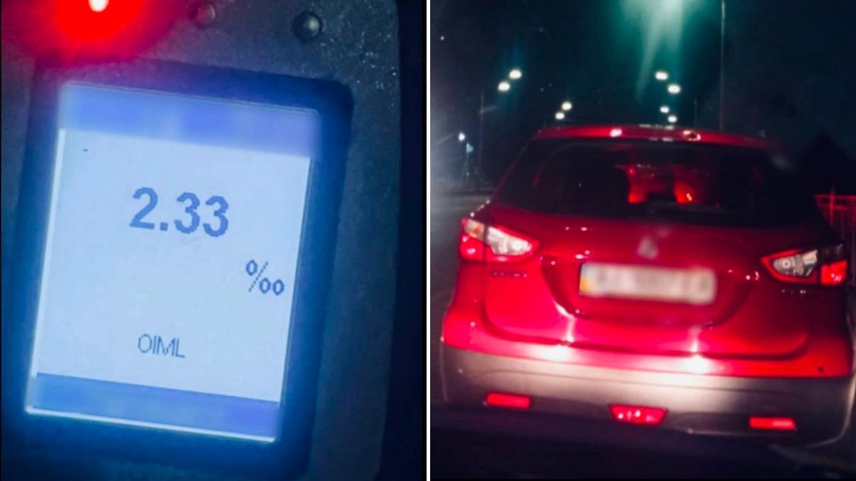 У Києві патрульні по гарячих слідах затримали п’яного водія, який втік після ДТП екран алкотестера з показником 2.33‰, поряд червоний легковий автомобіль на нічній вулиці з увімкненими задніми фарами