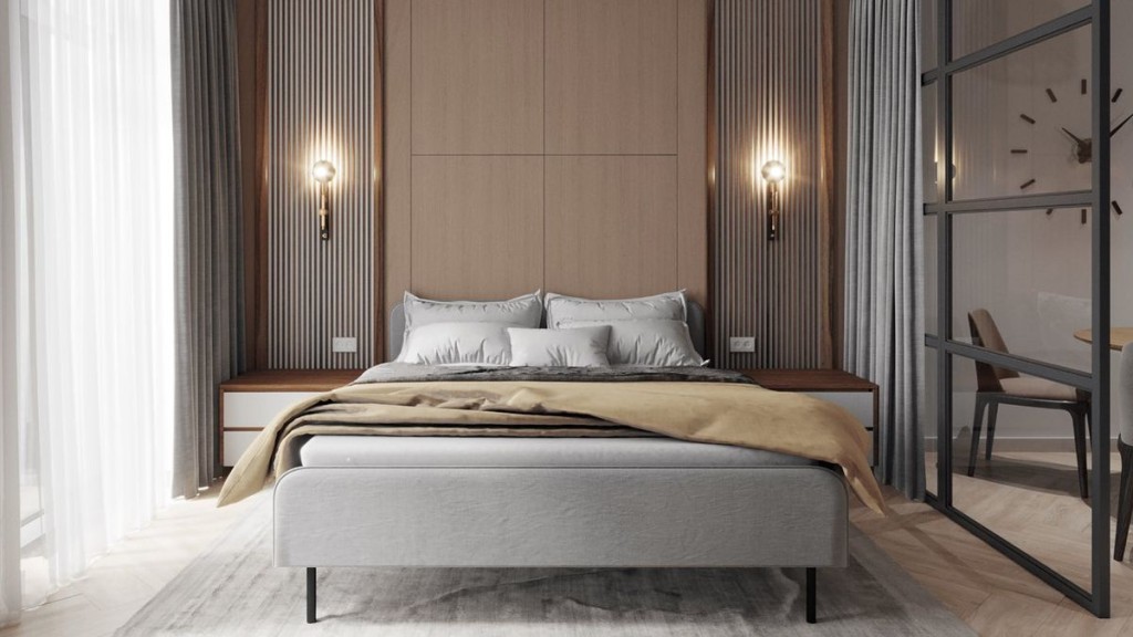 Спальня з великим двоспальним ліжком, сірою постіллю та стильним дерев’яно-металевим інтер’єром