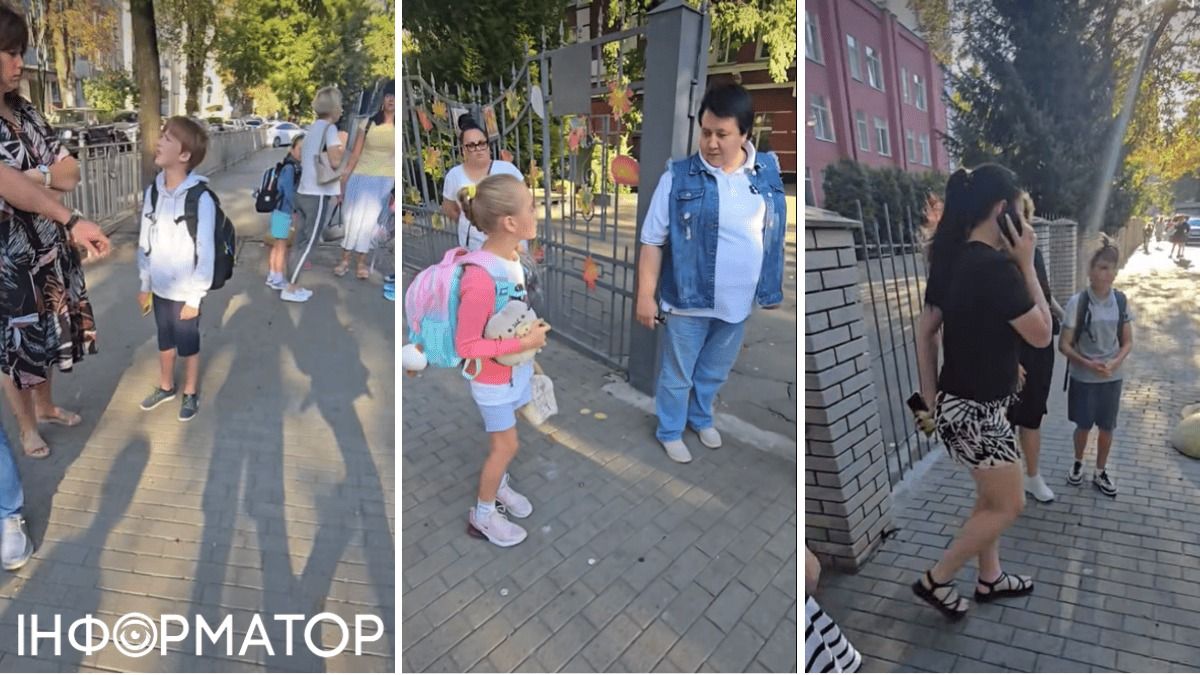 Маленька дівчинка спілкується з дорослими на вулиці Києва, школярі з рюкзаками перед школою, жінка говорить по телефону в місті.