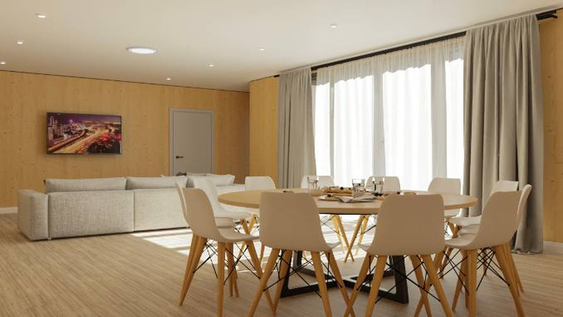 Велика світла кімната будинку з білим диваном і великим круглим столом з багатьма стільцями