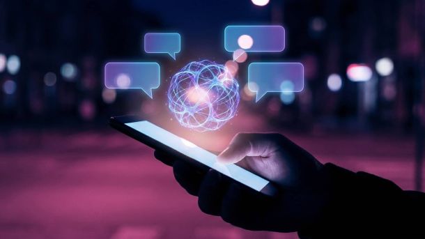 Половина студентів втрачає критичне мислення через ШІ Смартфон з бульбашками повідомлень, серед яких світиться штучна нейронна сфера — ілюстрація до новини про ШІ-чатбот у повідомленнях Threads