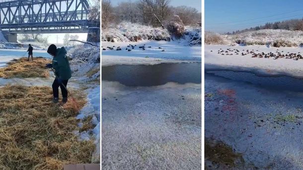 Ополонка в товстому льоду річки Ірпінь і група небайдужих людей що її налагоджують