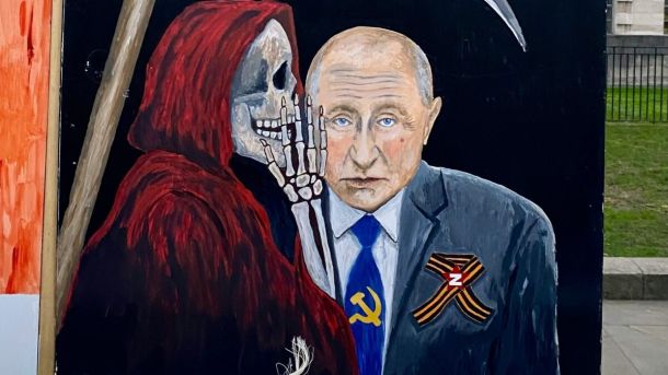 Карикатура на акції в Лондоні з вимогою до РФ припинити війну проти України