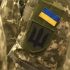 Шеврон із прапором України і тризубом на рукаві військової форми — Київщина отримала 648,9 млн грн на житло для ветеранів
